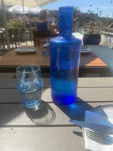 Blue glass table - table, bottle