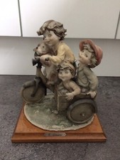 Vintage G Armani Figurine 3 Children, dog on Bike and Cart