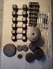 Various weight training plates, dumbbell bars, collars, EZ bar, and RC dumbbells