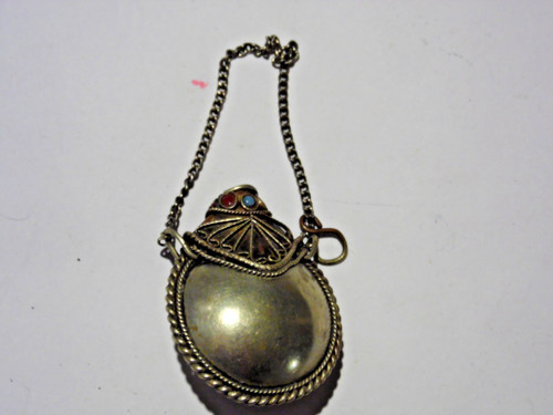 Antique pendant metal smelling