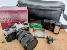 Olympus OM20 SLR 35mm film camera with 28 - 85mm Tokina AT-X Lens.