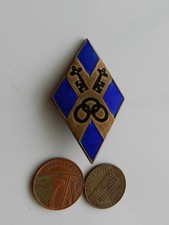 A VINTAGE BLUE & BLACK ENAMEL BADGE, GIRL GUIDES WEST MERCIA COUNTY.