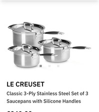 3 Le Creuset Stainless Steel Saucepans. silicone handles.