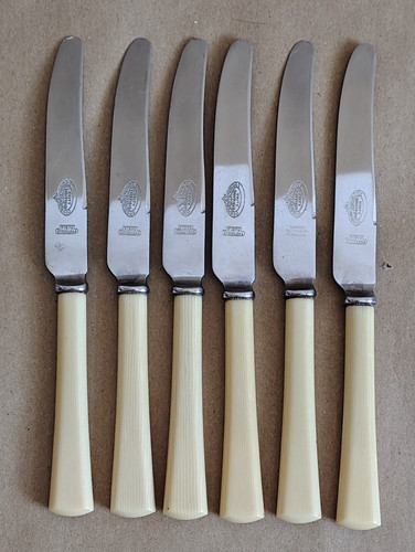 Six vintage table knives