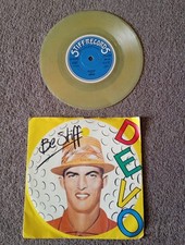 DEVO -  BE STIFF  7'' TRANSPARENT  YELLOW MILKY VINYL SINGLE IN PICTURE SLEEVE 