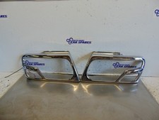 Mitsubishi shogun Headlight surrounds 99-06 pair of MK3 chrome genuine MZ312422