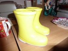 Pair yellow ceramic wellington boots