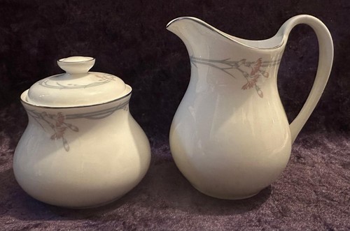 Milk jug and lidded sugar - and,