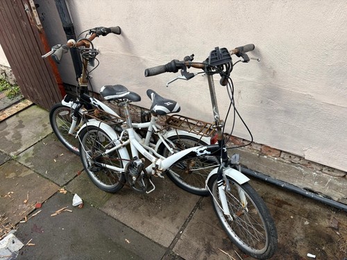 Two white foldable bicycles - two,