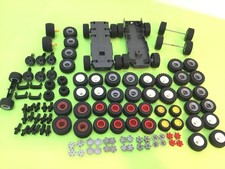 PLAYMOBIL HUGE BUNDLE OF VARIOUS WHEELS,AXLES,HUBCAPS X 28,WHEEL BASES,CLIPS.