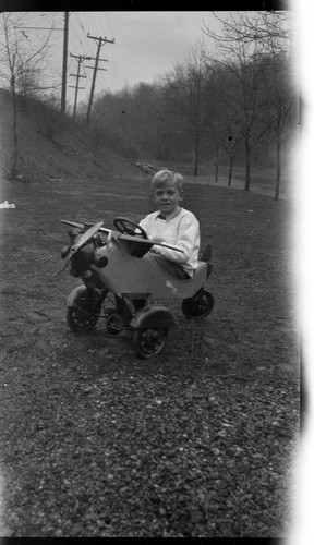 Young boy riding plane - young,