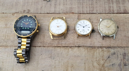 Four broken watches - four,