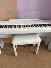 white Yamaha P-515 digital piano, with stand, pedals, user manual and stool