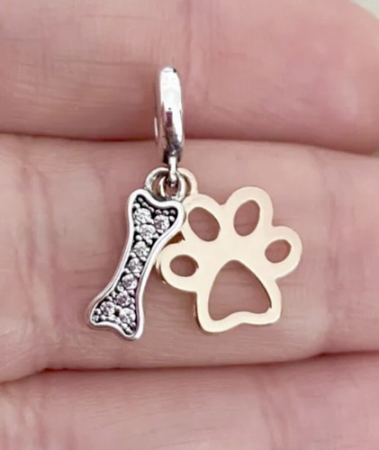 Paw print and bone charm - and,