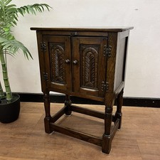 Small carved dark oak cabinet