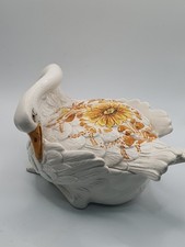 A swan with a bowed neck and head creating a vessel with a lid Trinket Dish