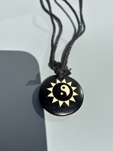 Black stone yin yang - yang, sun