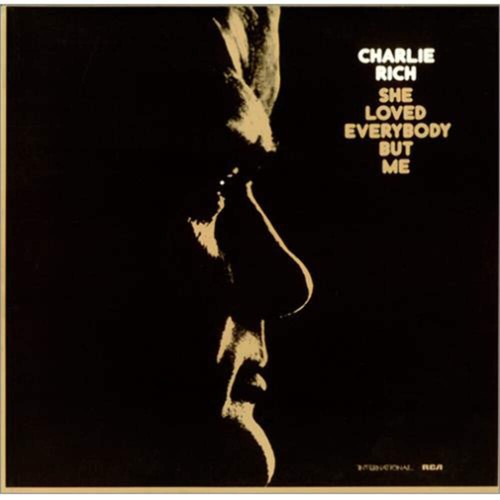 Charlie rich she loved - -,