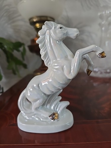 Porcelain horse figurine made - porcelain,