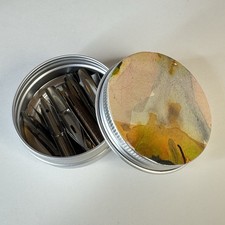 Vintage tin of unused mixed