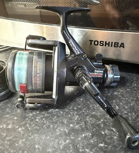 Daiwa 1657dm reel with spare - 1657dm,