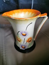 art deco ceramic jug myott & son. Orange and with decorative flowers. 
