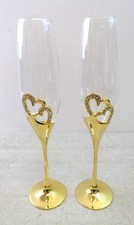 Set of 2 champagne flutes. Crystal with gold coloured metal base with hearts