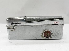 VINTAGE METAL STARLON POCKET GAS LIGHTER SMOKING TOBACCIANA CAT'S-EYE