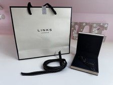 Links of London gift bag, 9x9cm jewellery display  and 100cm of official ribbon.