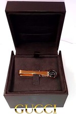 Vintage Gucci Gold Tone Tie Clip , Gold Double G Logo Set On A Black Background.