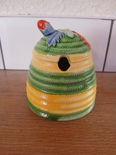 Studio pottery honey pot with lid, bee hive and floral design, 10.5cm