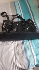 black leather bag with short handles and shoulder strap - new in good condition