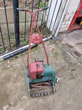 Two petrol lawn mowers - for