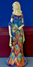 Benaya ceramic tubelined figurine lady with peacock pattern dress, signed JP'07