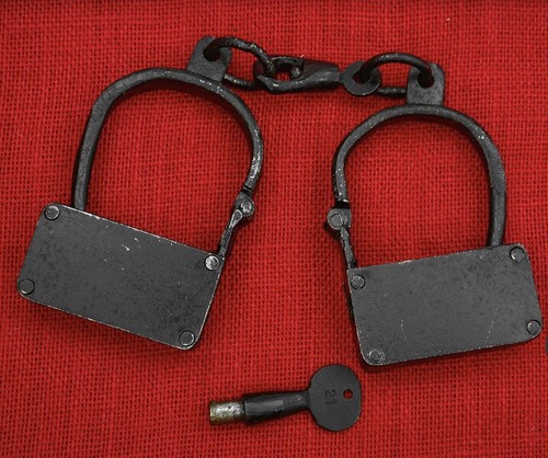 Boxed iron manacles - boxed, cast