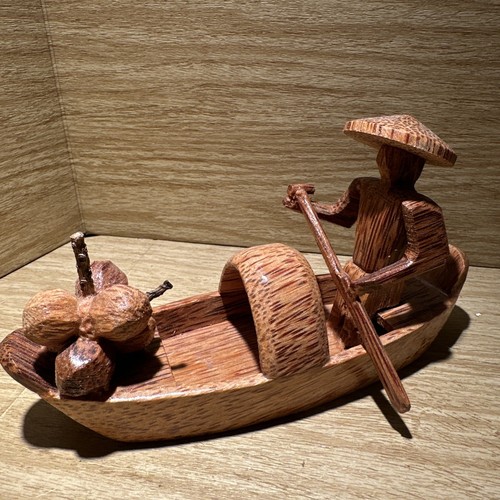Carved man rowing - man, boat