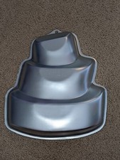 - NWOT Wilton Topsy Turvy cake