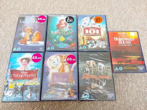 Walt disney dvds - 7, new