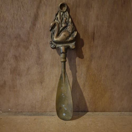 Brass shoe horn featuring - horn,