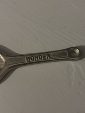 VINTAGE CAST IRON BOTTLE
