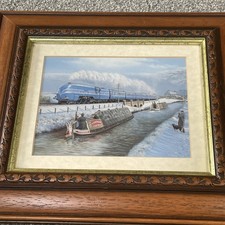 Vintage Framed Print Of a Steam Engine Passing a Narrow Boat On a Winters Day