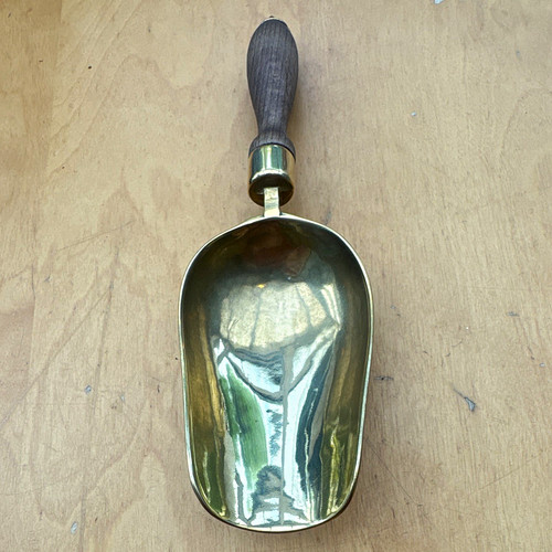 Brass metal scoop with dark - metal,