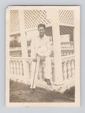 Old B&W Photo Man sitting on balustrade Trellis White clothes Walking Cane