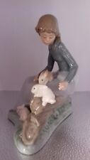 Nao by Lladro Porcelain Figure : Young Girl Sat on Tree Logs with Three Rabbits
