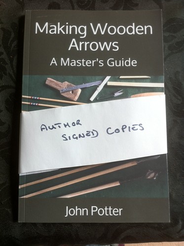 Making wooden arrows a - making,