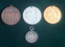 NORTHAMPTON SCHOOL ATTENDANCE MEDALS (SMALL ONE H/M SILVER 14.9)