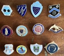 A GROUP OF ENAMEL BOWLING BADGES