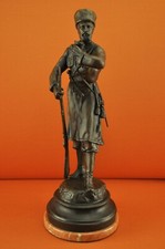 A bronze Russian sculpture of a Cossack Soldier, signed lower base E Lansere