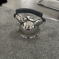 An Alessi 9091 Stainless Steel Stovetop mama o Kettle designed by Richard Sapper