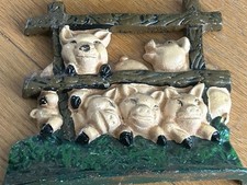 Vintage Cast Iron Pig Doorstop Featuring Five Pigs Peeking Behind A Fence